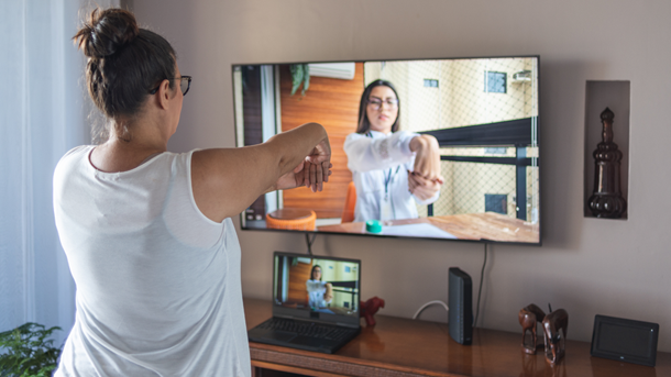 Female preforming virtual treatment for pain exercises.